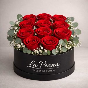 Caja redonda negra con 12 rosas rojas